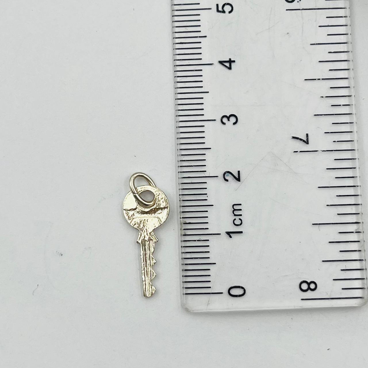 Dije de Llave Mini en Plata 925